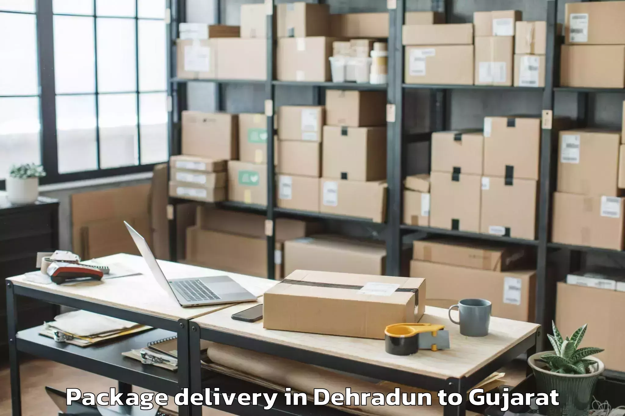 Quality Dehradun to Sardarkrushinagar Dantiwada Ag Package Delivery